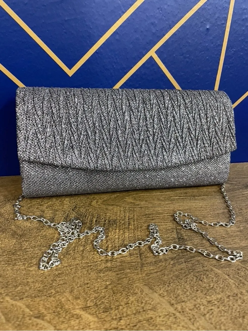 Pochette brillantinata chiusura tonda