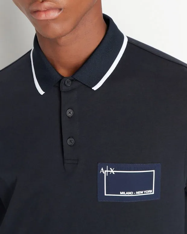 Polo blu a manica lunga in cotone con patch porta logo sul petto e bordino in contrasto