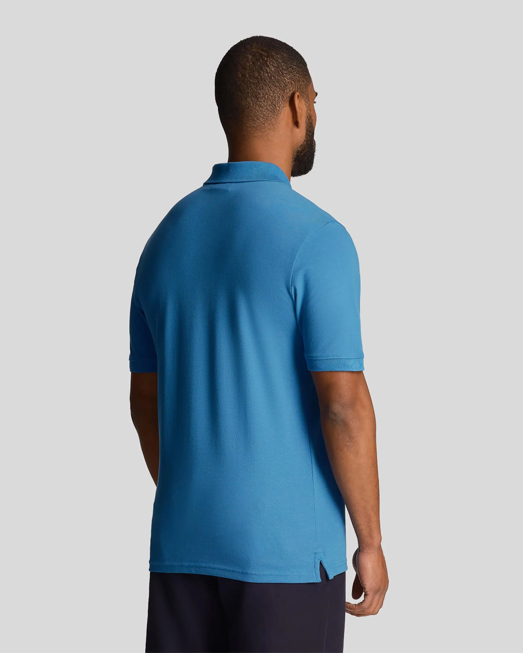 Polo blu royal mezza manica in piqué di cotone stretch con logo aquila gialla ricamato