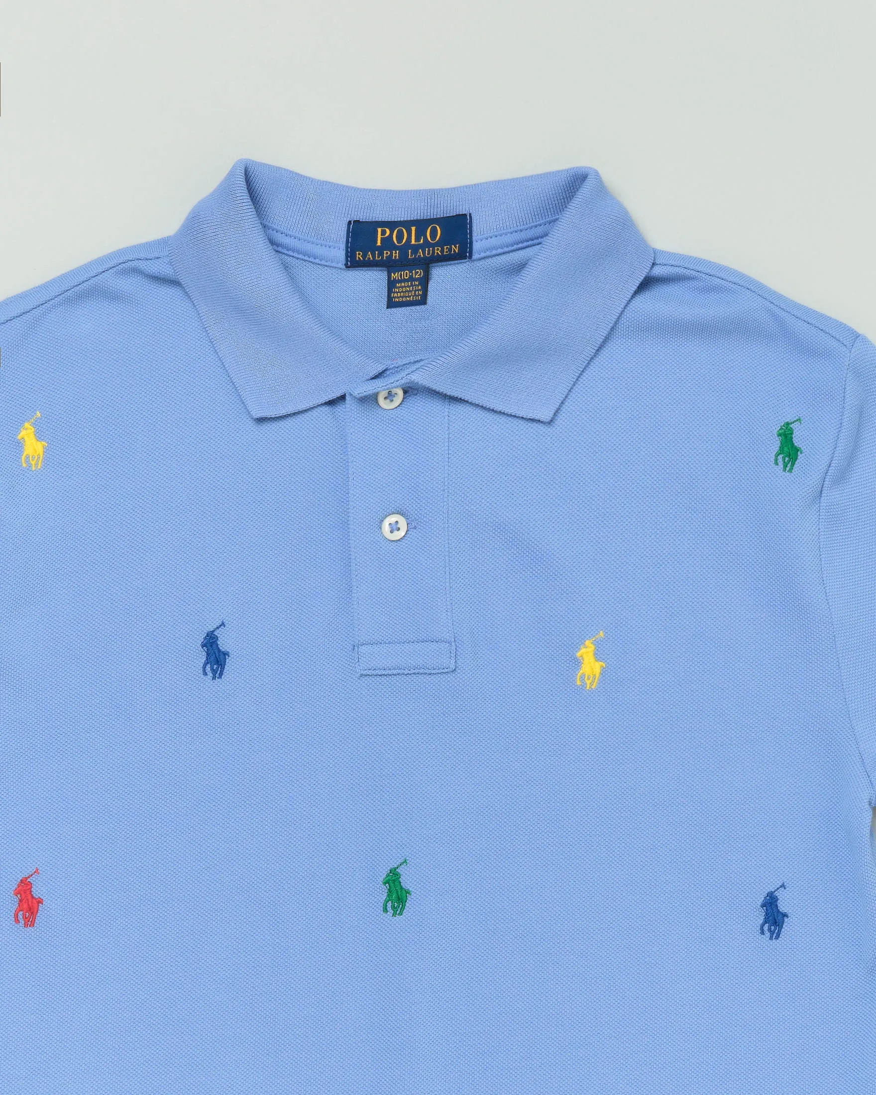 Polo celeste mezza manica in piquet di cotone con pony colorati all-over 4 anni