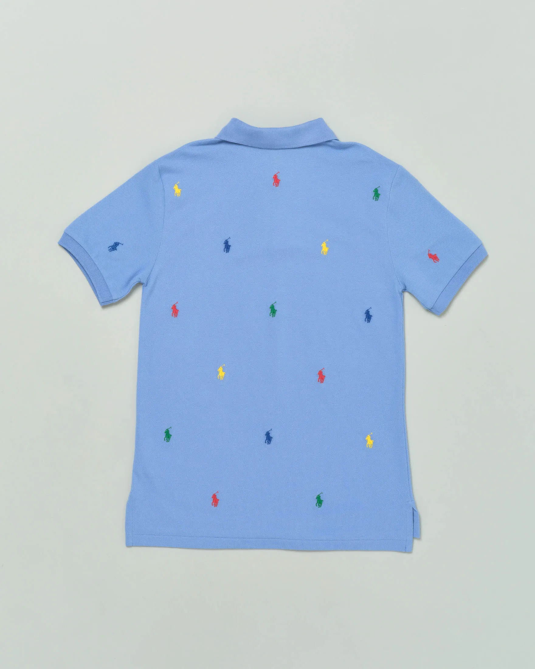 Polo celeste mezza manica in piquet di cotone con pony colorati all-over 4 anni